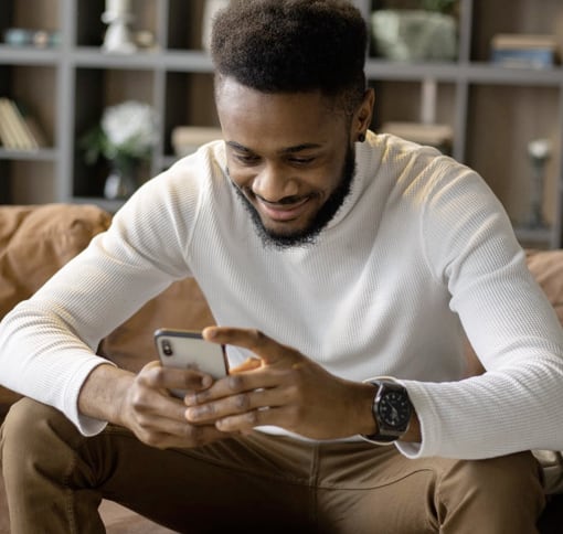 Image of man texting on cell phone