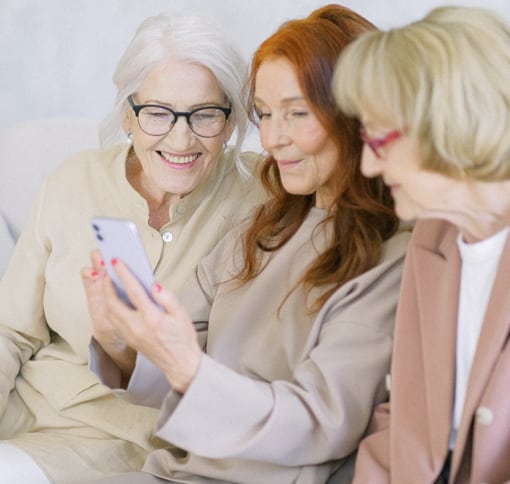 Three women videochatting on cell phone